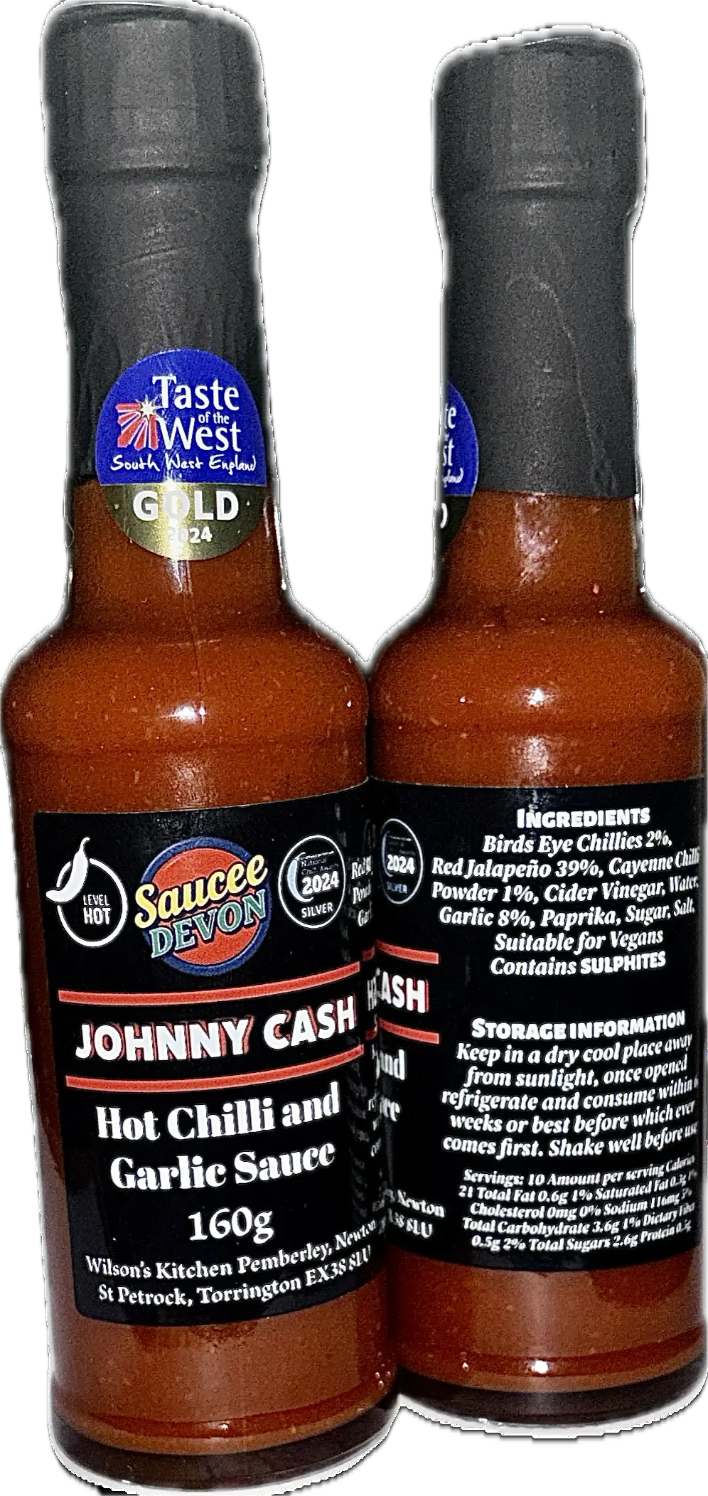 Wilson’s Kitchen hot chilli and garlic artisan chili sauce in a glass jar with red chilli peppers and garlic cloves visible inside.