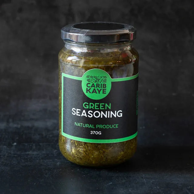 CaribKaye green seasoning marinade in a jar, used for grilling and flavoring meats and vegetables.