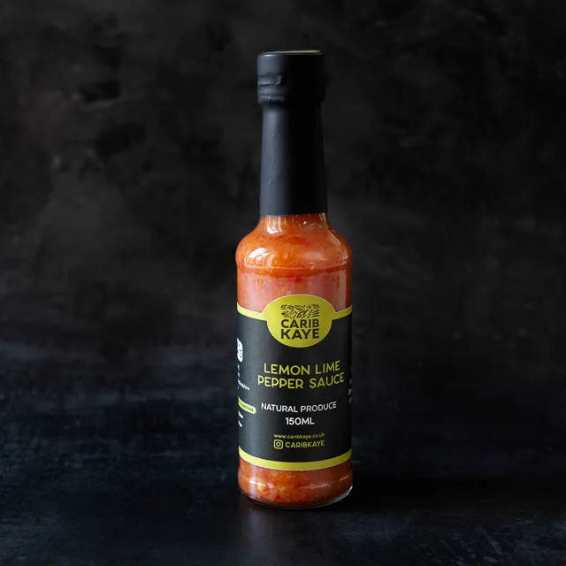 CaribKaye Lemon Lime Pepper Hot Sauce bottle with vibrant label, showcasing the spicy sauce in a clear glass bottle.