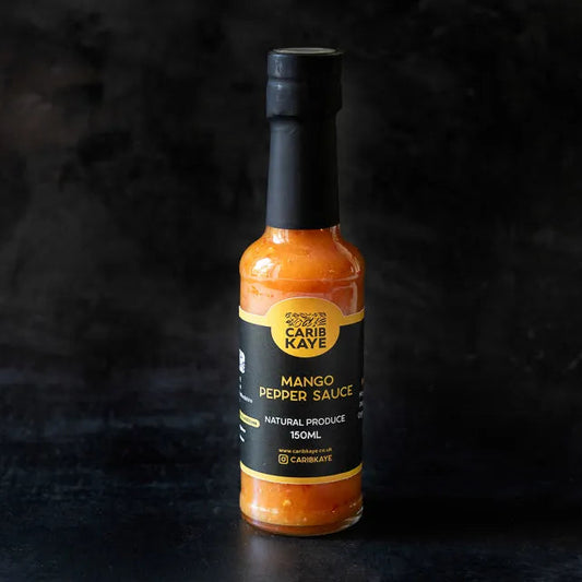 CaribKaye Mango Pepper Hot Sauce bottle with vibrant label, showcasing the spicy mango flavor and hot sauce branding.