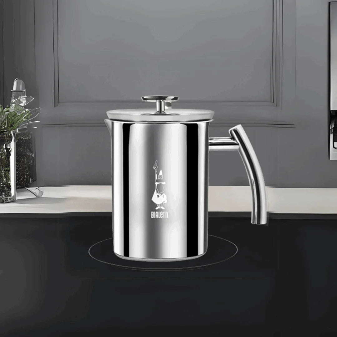 Bialetti Brew Italia manual milk frother on induction hob, stainless steel with black handle for frothing milk
