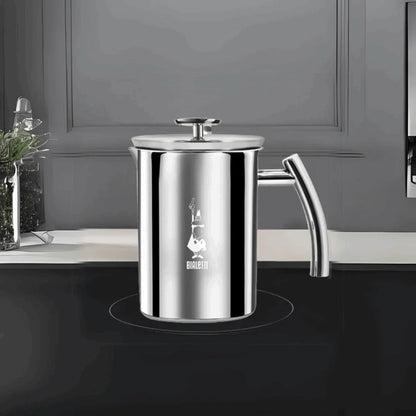 Bialetti Brew Italia manual milk frother on induction hob, stainless steel with black handle for frothing milk