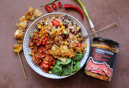 Organic Kimchi by Loving Foods with hot and smoky flavors, featuring visible pieces of fermented vegetables and spices.