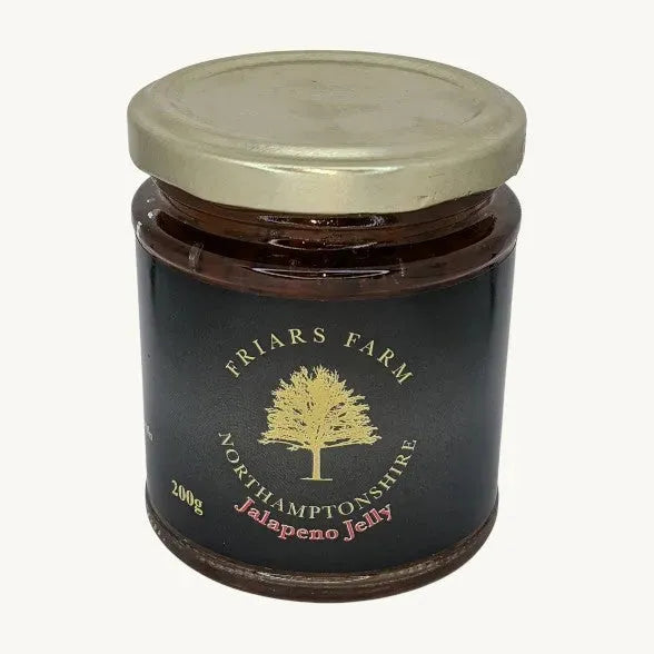 Jalapeno Jelly 200g from Friars Farm, vibrant green chili jam in a jar with a spoon, showcasing its spicy, glossy texture.