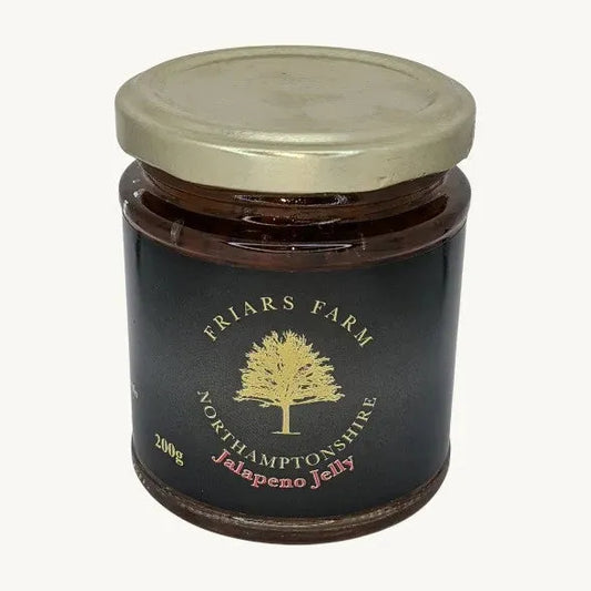 Jalapeno Jelly 200g from Friars Farm, vibrant green chili jam in a jar with a spoon, showcasing its spicy, glossy texture.