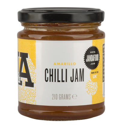 Janda Amarillo Yellow Chilli Jam 210g jar with vibrant yellow chili jam, perfect for cheese and barbecue dishes.