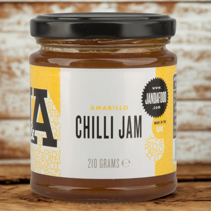 Janda Amarillo Yellow Chilli Jam 210g jar with bright yellow chili jam, showcasing its sweet and spicy flavor for cheese and barbecue dishes.