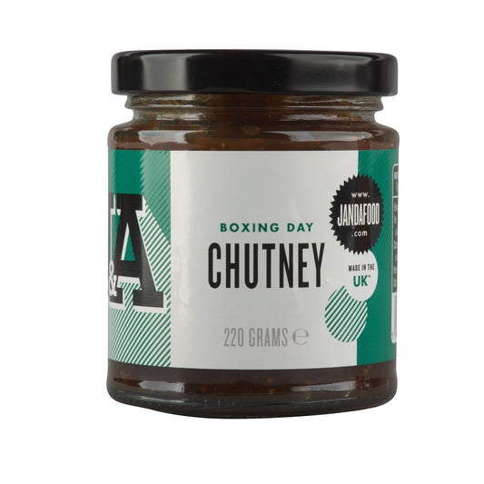 Janda Food Boxing Day Chutney in a glass jar with a black lid, featuring a green and white label.