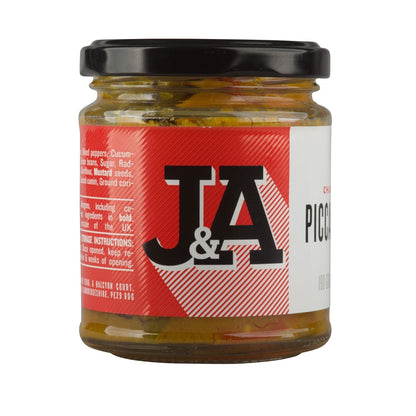Jar of Janda Food Chunky Piccalilli with visible chopped vegetables and mustard seeds in a clear glass jar.