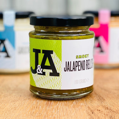 Janda Smoky Jalapeno Relish in a jar, showcasing vibrant green jalapenos and smoky seasoning, perfect for adding flavor.