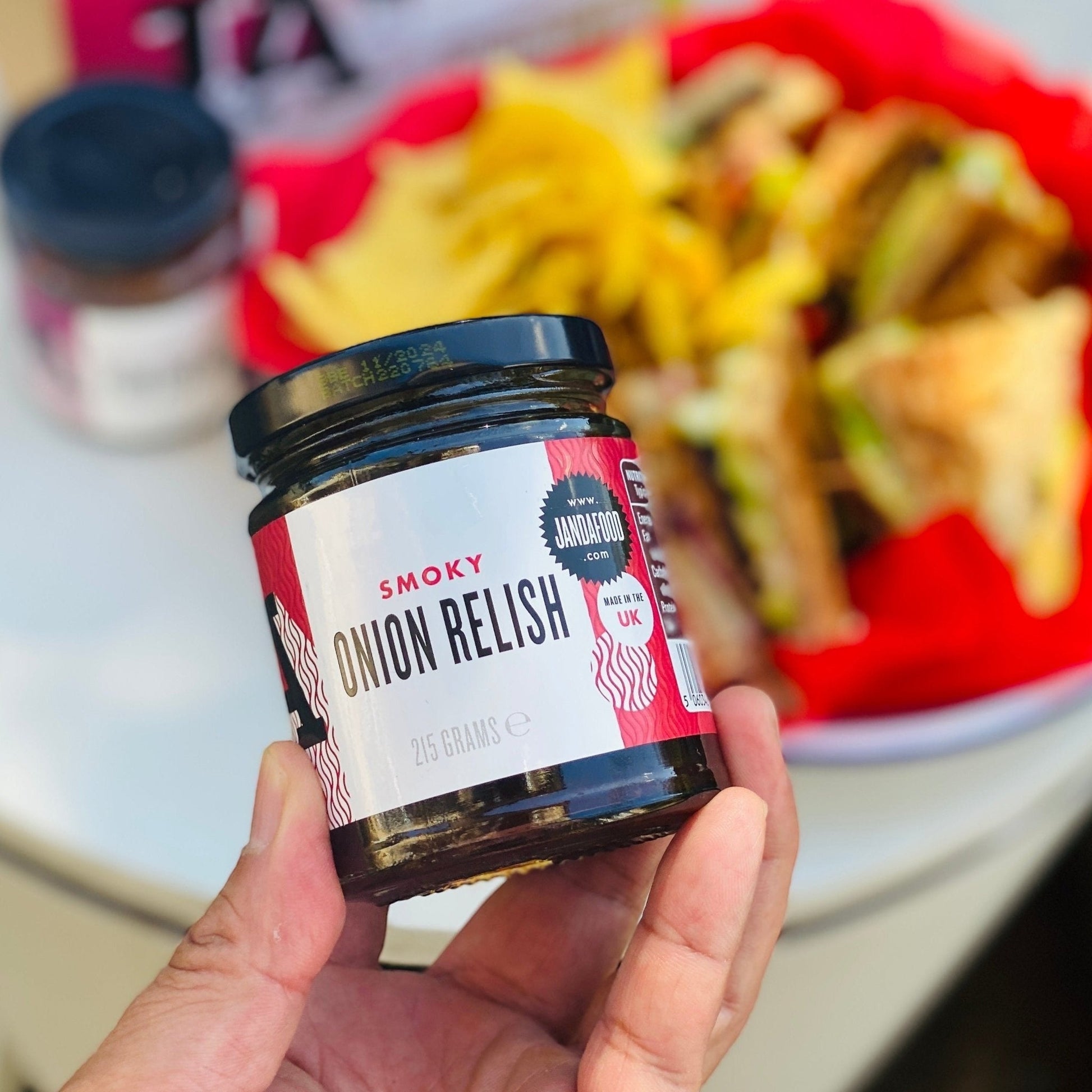 Janda Food Smoky Onion Relish jar with dark, caramelized onions and smoky glaze, ideal as a gourmet cheese condiment.
