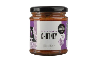 Janda spiced tomato chutney jar with vibrant red and orange hues, showcasing the flavorful, chunky condiment in a glass jar.