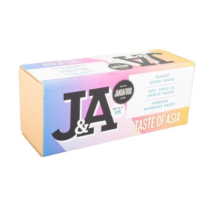 Janda Taste of Asia gift box with assorted colorful Asian snacks and treats inside a decorative box.
