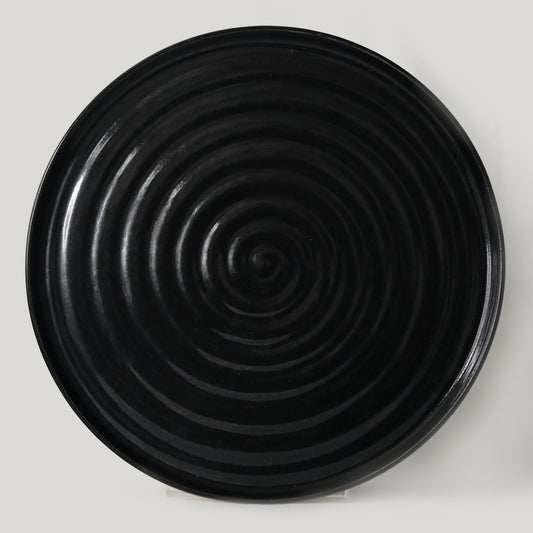 Jet black ceramic dinner plate by Katie L Thompson Designs, featuring a sleek and modern classic design for elegant dining.