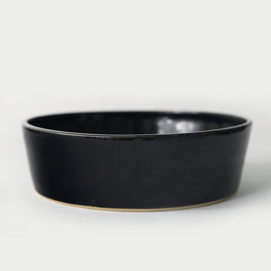 Jet black classic pasta bowl by Katie L Thompson Designs, showcasing a sleek, round ceramic bowl for serving pasta.
