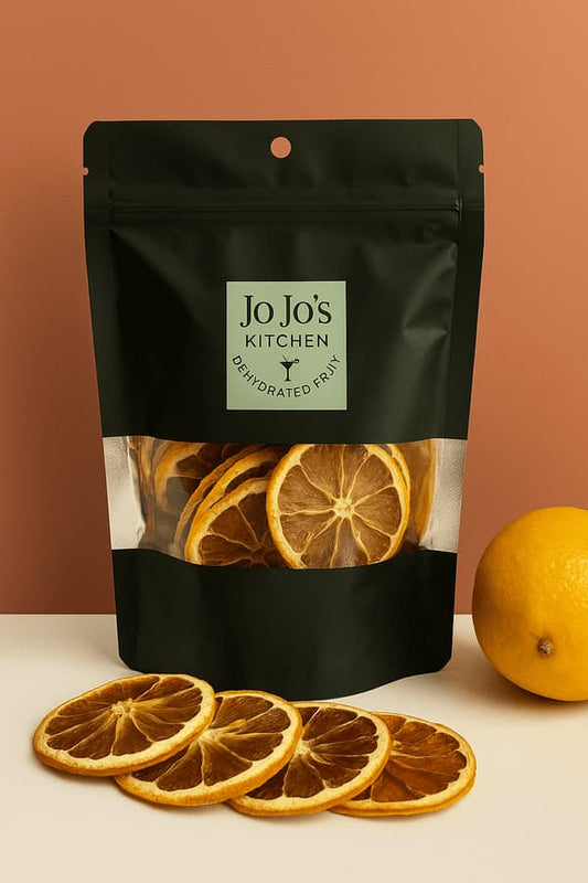 Dehydrated lemon slices from JoJo’s Kitchen, vibrant yellow citrus slices with textured, dried surface for cooking or garnishing.