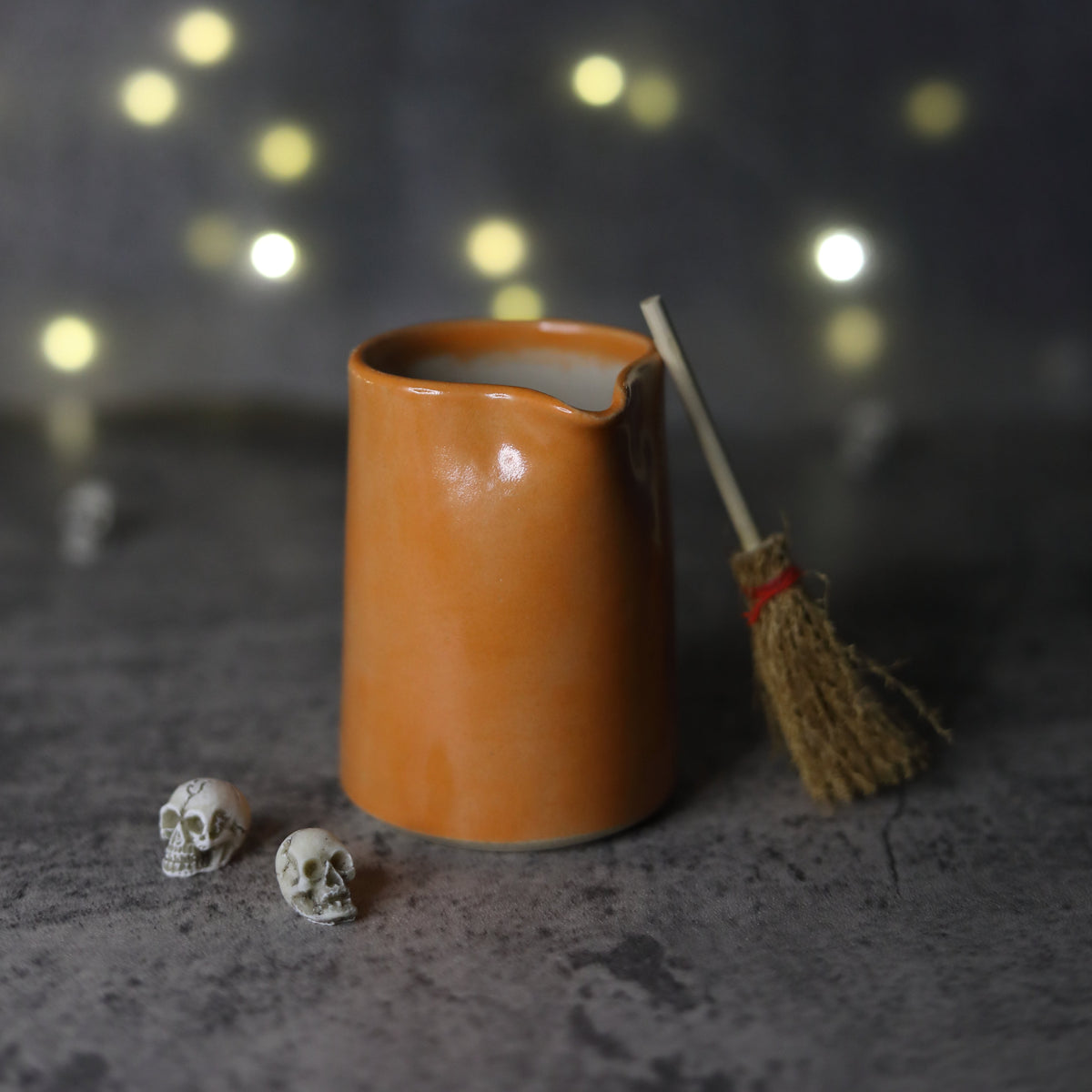 Katie L Thompson Designs Mandarin Orange Classic Small Jug with a smooth ceramic finish and elegant handle.