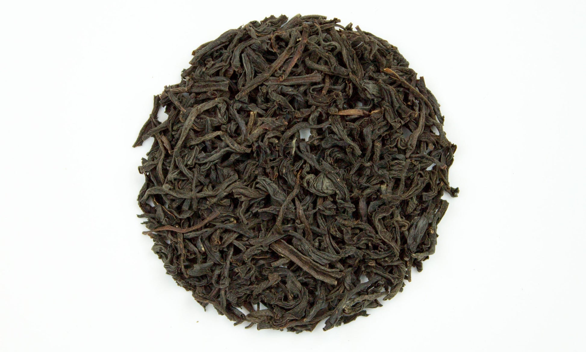 Kenilworth Ceylon Orange Pekoe tea from PekoeTea Edinburgh, featuring a close-up of the tea leaves in a clear glass jar.