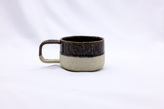 Large handmade ceramic mug by Ribera Handmade Ceramics with a textured, milled stoneware design and a glossy finish.