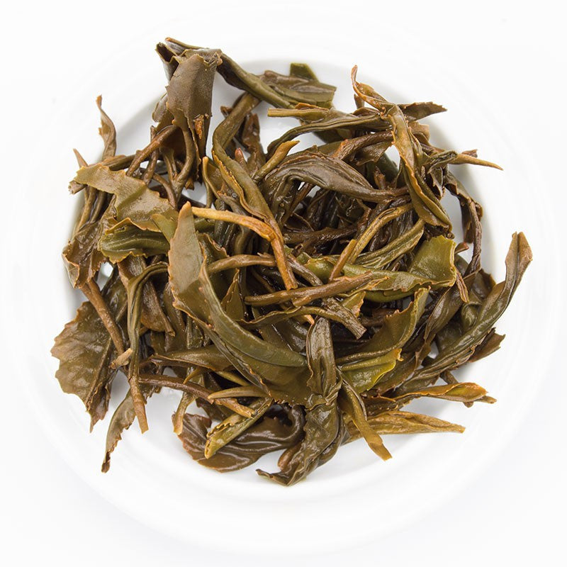 Brewed Kinnettles Gold Scottish Grown Tea from PekoeTea Edinburgh in a teacup, showcasing its rich amber color and fresh aroma.