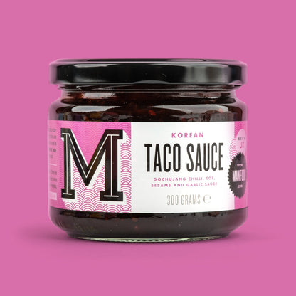 Manfood Korean Taco Sauce in a glass jar with vibrant label, showcasing the spicy, flavorful sauce for tacos and Asian-inspired dishes.