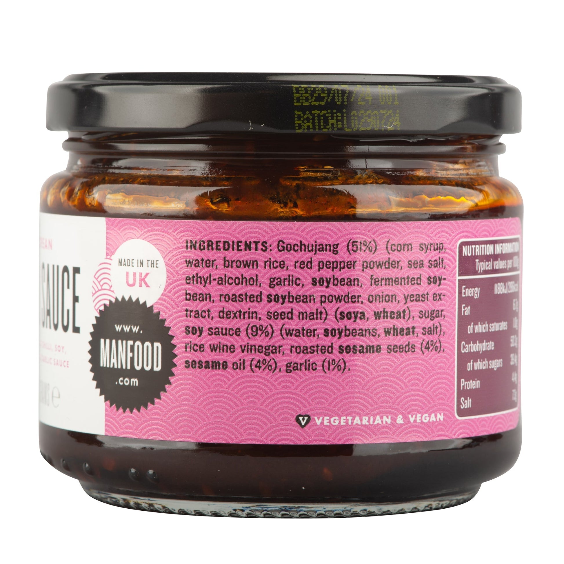 Manfood Korean Taco Sauce bottle with label, showcasing vibrant red sauce in a clear glass container, ready for tacos or dishes.