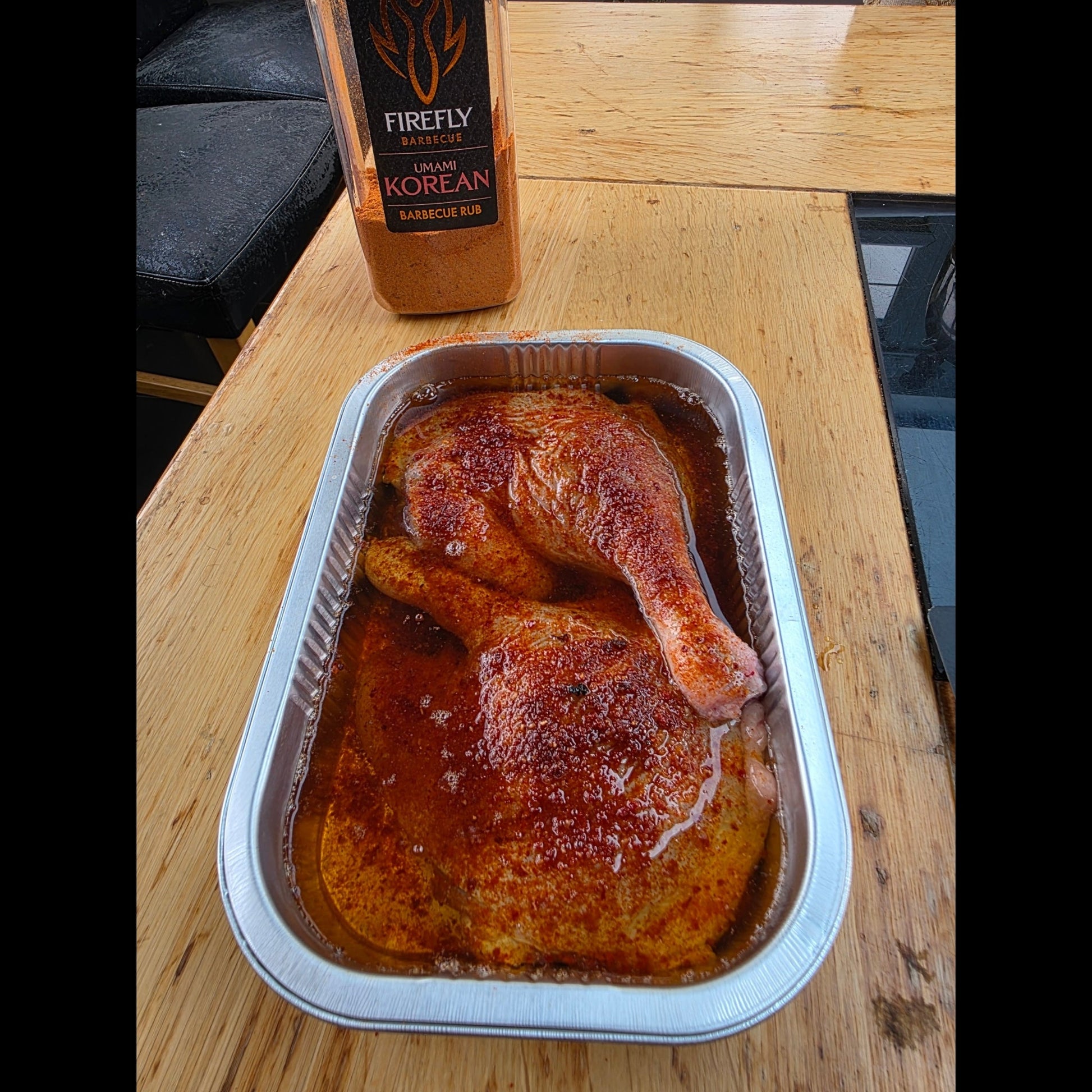 FireFly Barbecue Korean UMAMI BBQ Rub on duck, showing the spice blend and glazed meat for flavorful grilling.