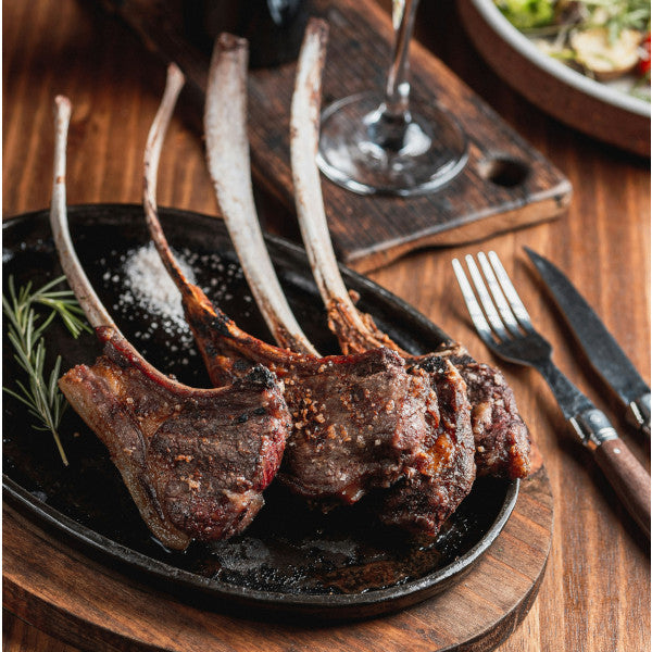 Goodness in a Bowl lamb seasoning rub in a jar, with herbs and spices for flavorful lamb dishes.