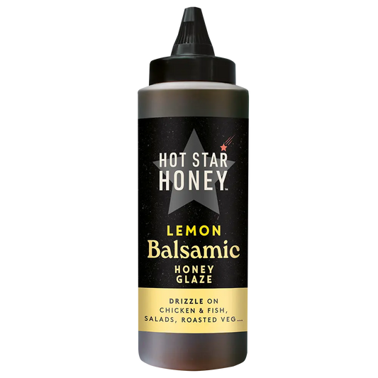 Hot Star Honey Lemon Balsamic Honey Glaze bottle with a clear label, showcasing the golden glaze in a glass bottle.