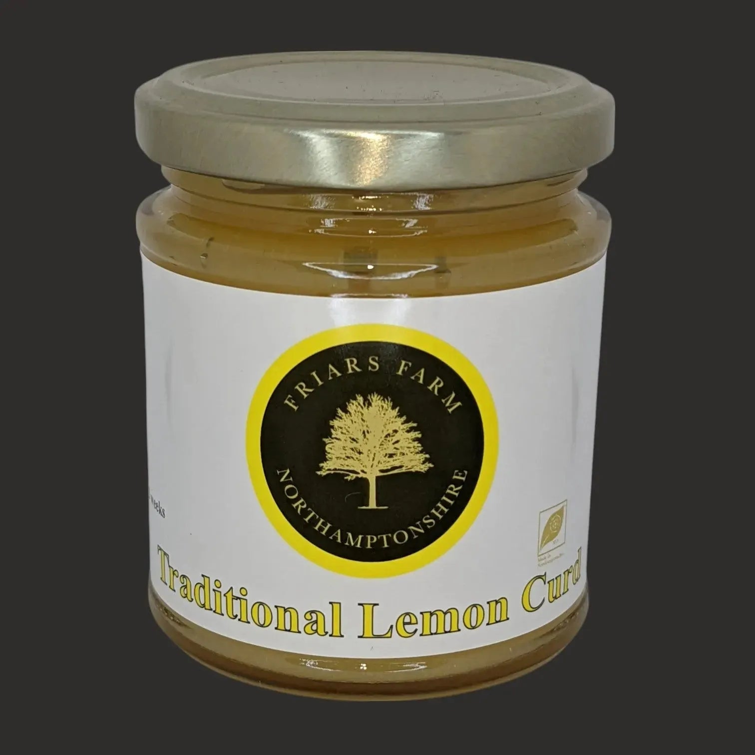 Cropped image of Friars Farm traditional lemon curd jar, showcasing the smooth, vibrant yellow lemon-flavored spread.