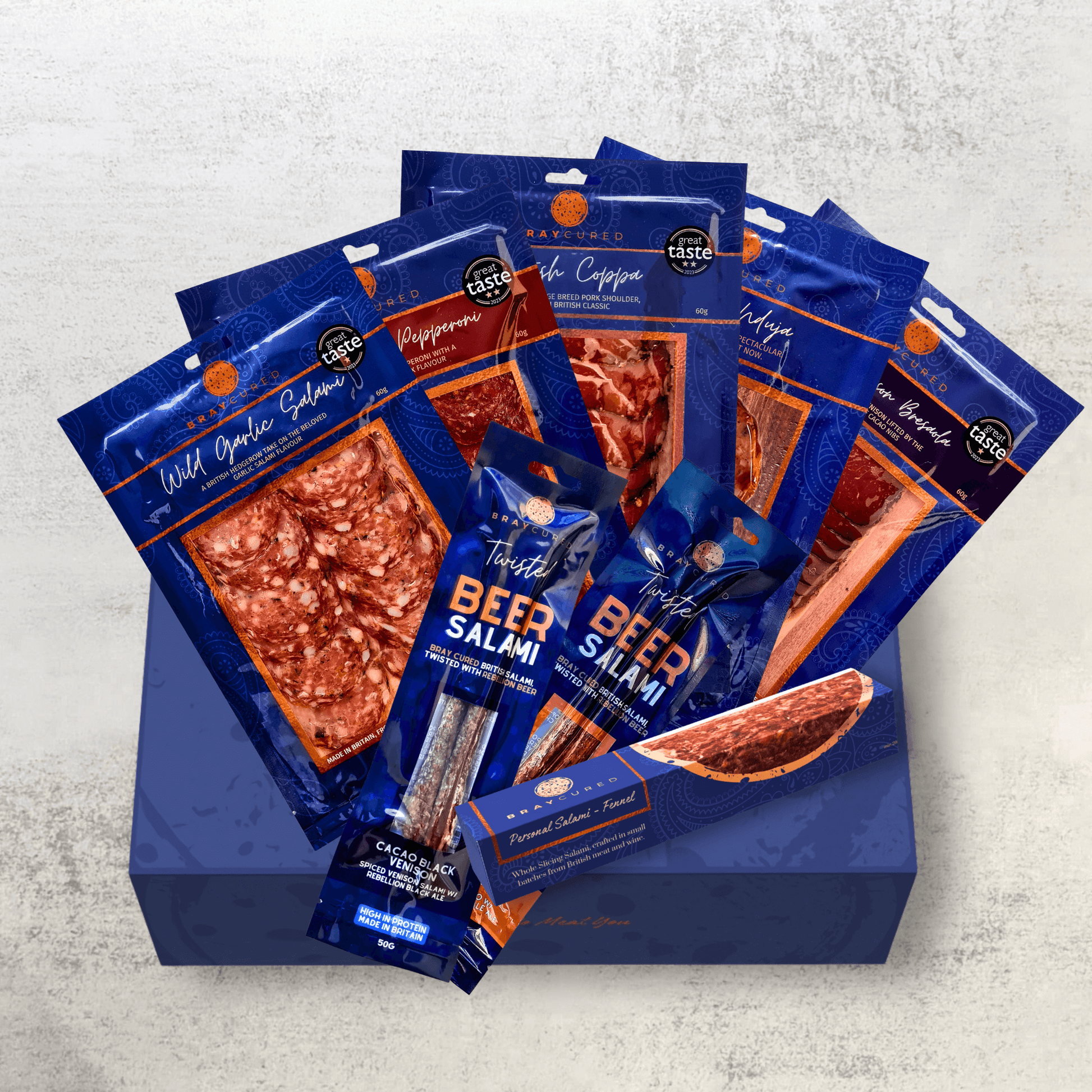 Assorted Bray Cured charcuterie selection featuring cured meats and delicacies on a wooden platter.