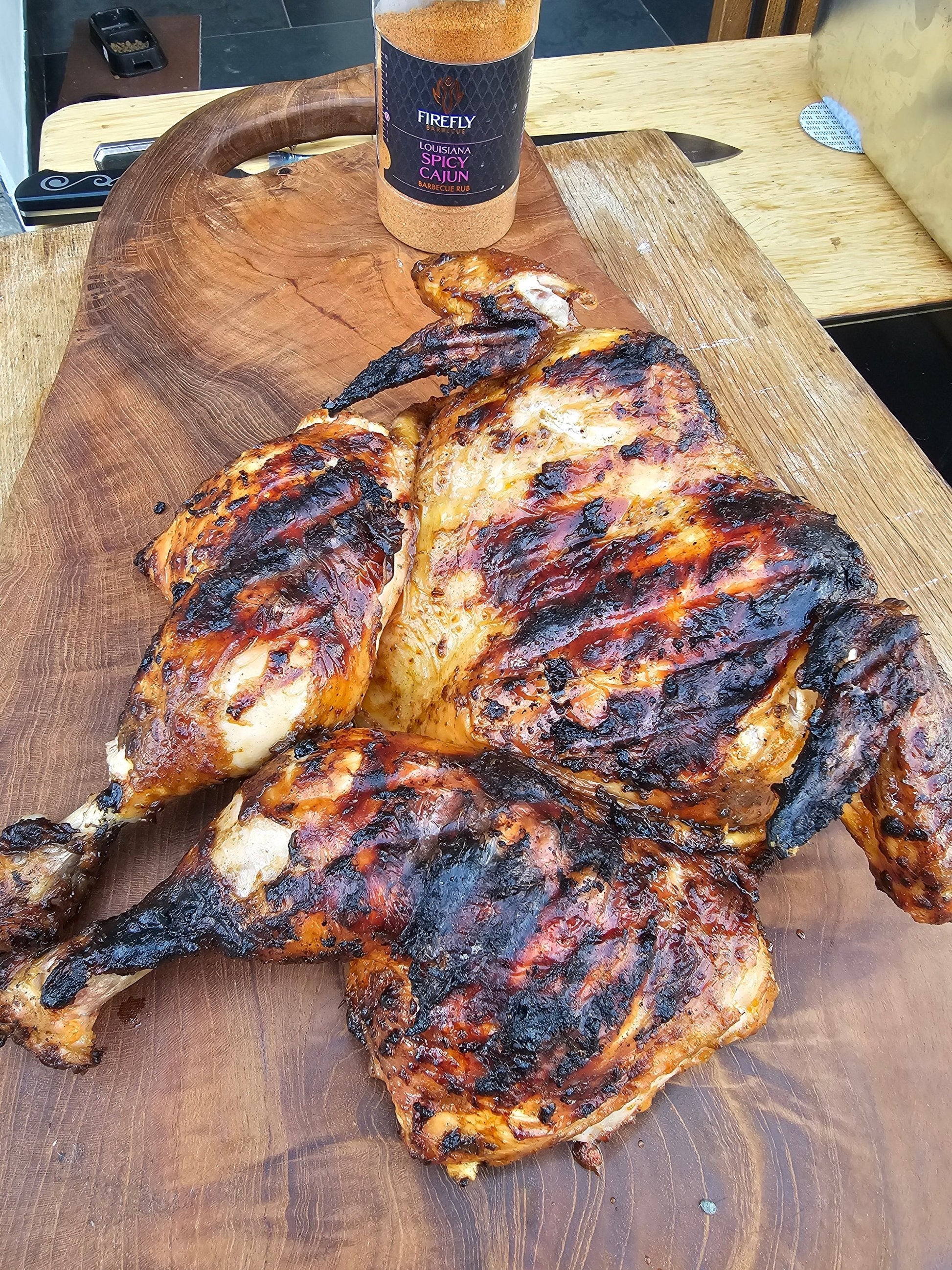 FireFly Barbecue Cajun BBQ rub from the BBQ Legend 3 Spicy Rubs Gift Pack, featuring vibrant spices in a jar.