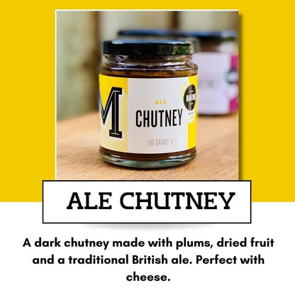 Jar of Manfood Traditional Ale Chutney with rich, dark color and label featuring the Manfood brand, displayed on a wooden surface.