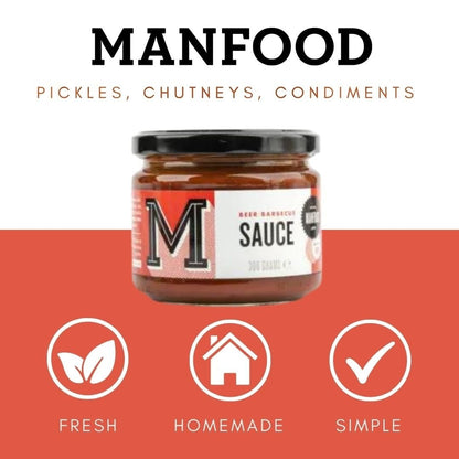 Bottle of Manfood Beer Barbecue Sauce with label visible, showcasing rich, dark sauce suitable for grilling and outdoor cooking.