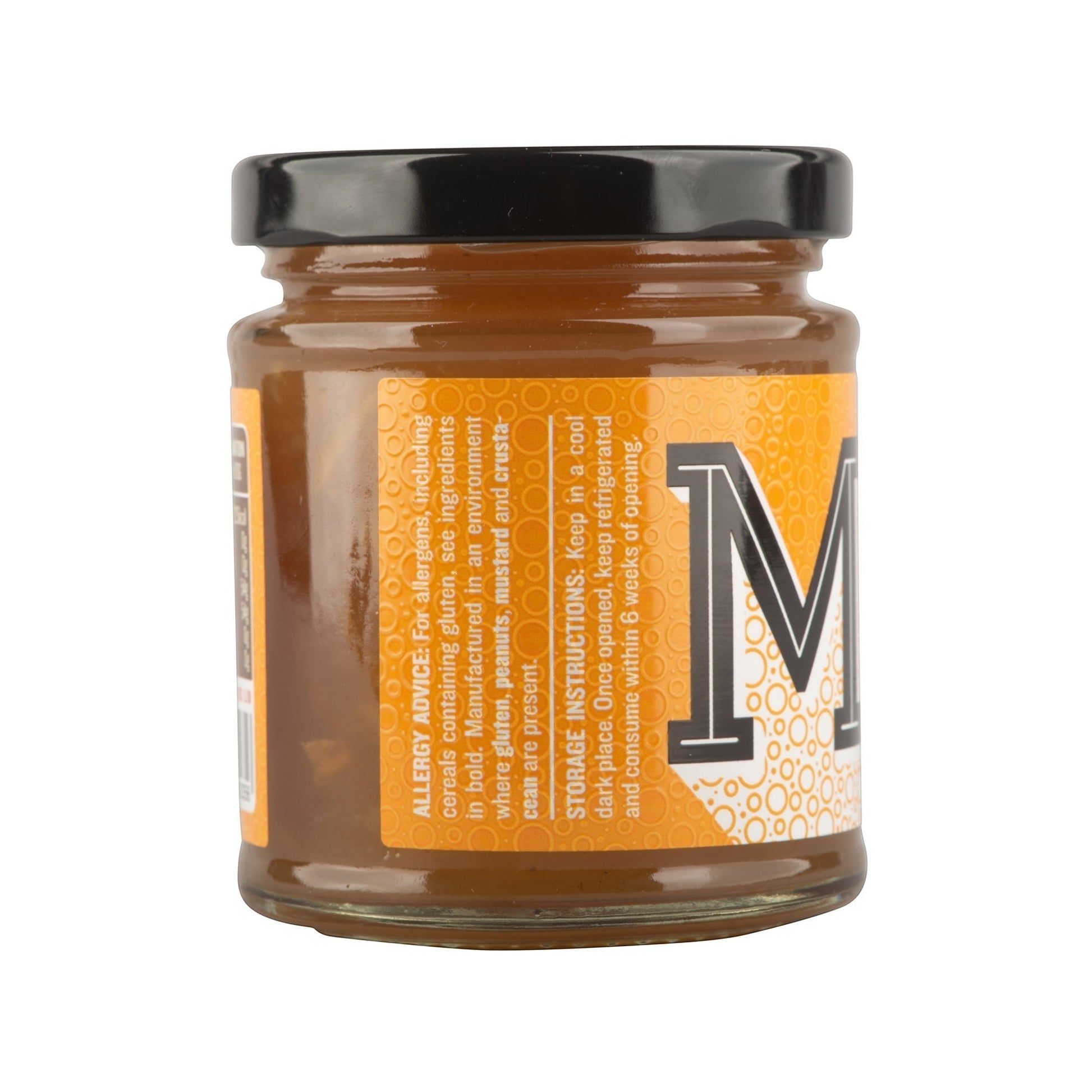 Manfood Hot Toddy Marmalade preserve in a jar with a golden orange color and label, perfect for spreading on toast.