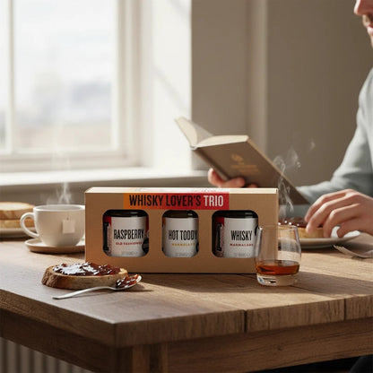 Manfood Whisky Lover's Trio Marmalade Gift Set in a gift box with three jars of whisky-flavored marmalade from the Manfood brand.