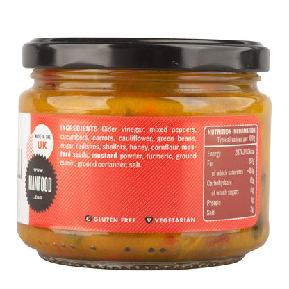 Jar of Manfood Chunky Piccalilli, a crisp vegetable relish with colorful chunks of pickled vegetables in a glass jar.