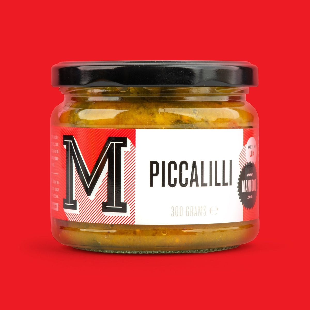 Jar of Manfood Chunky Piccalilli vegetable relish with visible chunky vegetables in a glass jar.