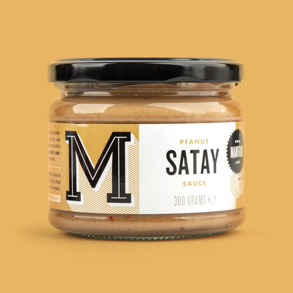 Manfood Peanut Satay Sauce in a 300g glass jar with a black lid against a solid yellow background.