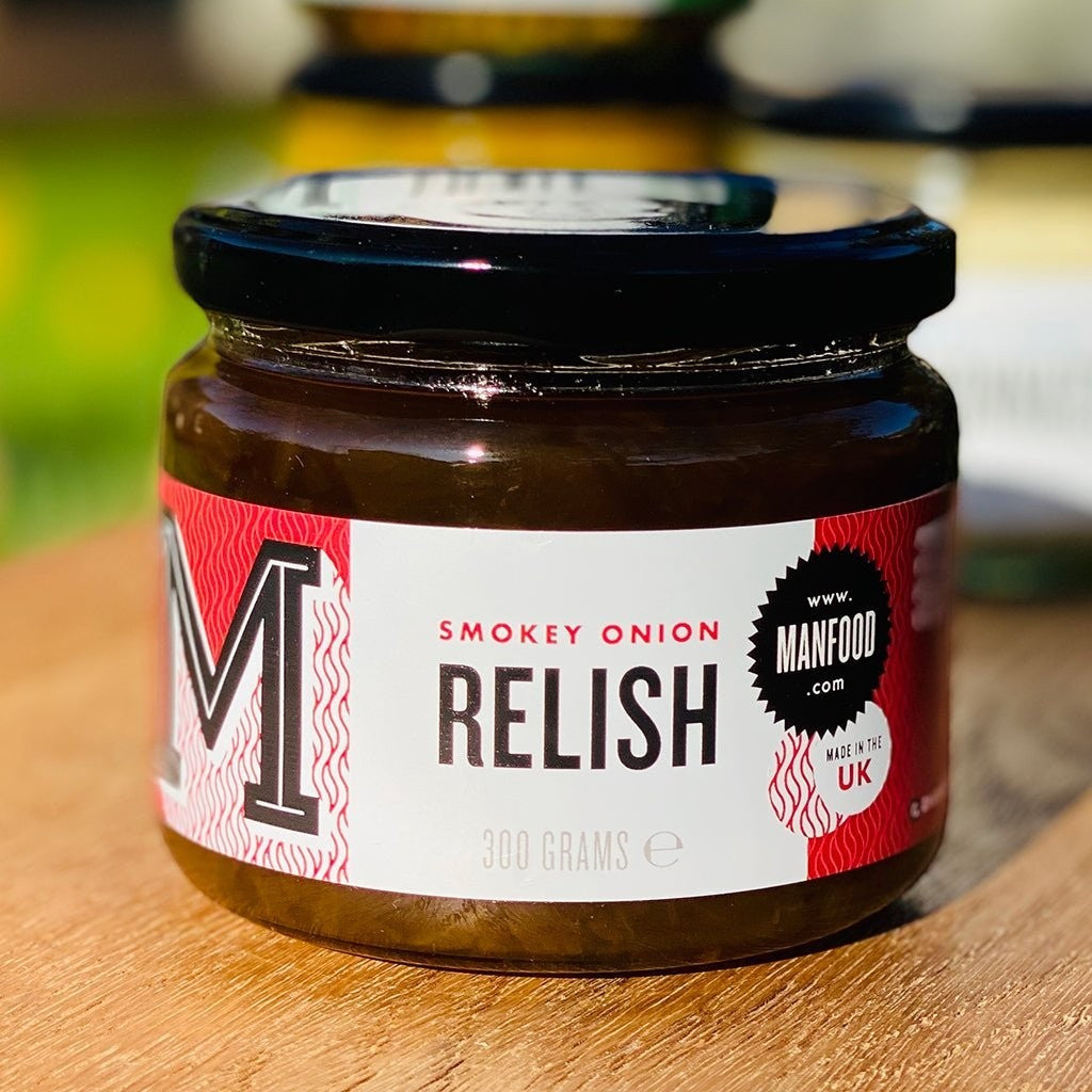 Manfood Smokey Onion Relish in a jar, showcasing its dark, smoky appearance and chunky onion texture, ready to add flavor to dishes.