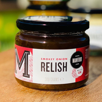 Manfood Smokey Onion Relish in a jar, showcasing its dark, smoky appearance and chunky onion texture, ready to add flavor to dishes.
