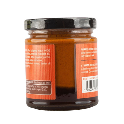 Manfood Vegan Buffalo Sauce bottle with butter-flavored chili and onion sauce, shown in a close-up image.