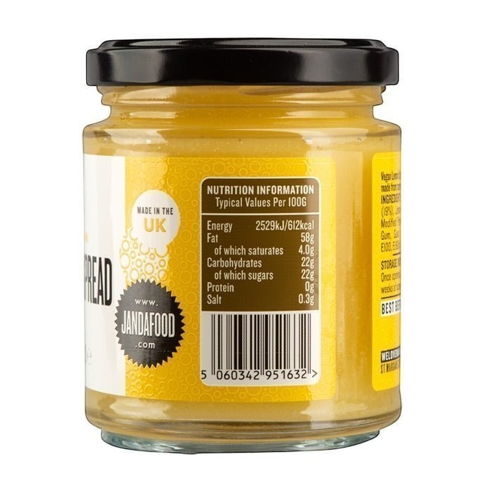 Jar of Manfood vegan lemon curd, an artisan lemon spread with vibrant yellow color and smooth texture.