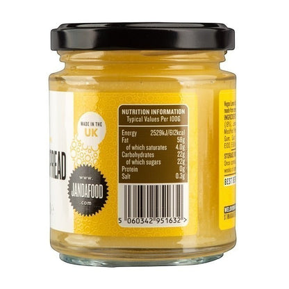 Jar of Manfood vegan lemon curd, an artisan lemon spread with vibrant yellow color and smooth texture.
