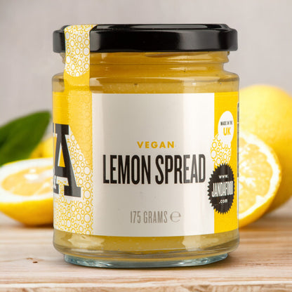 Jar of Manfood vegan lemon curd spread showing the label and jar with a bright yellow lemon flavor.