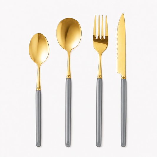 KitchBoom Marlowe 16-piece gold cutlery set with pearl grey handles, including forks, knives, spoons, and teaspoons arranged neatly.
