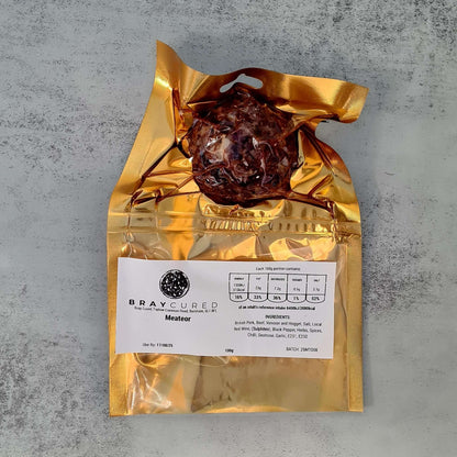 Front view of Bray Cured Meateors charcuterie pack featuring assorted cured meat slices and meats in a clear packaging.