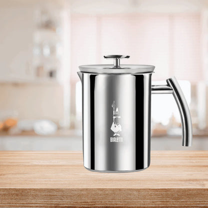 Bialetti Brew Italia manual milk frother with stainless steel body and ergonomic handle for creamy froth and latte art.
