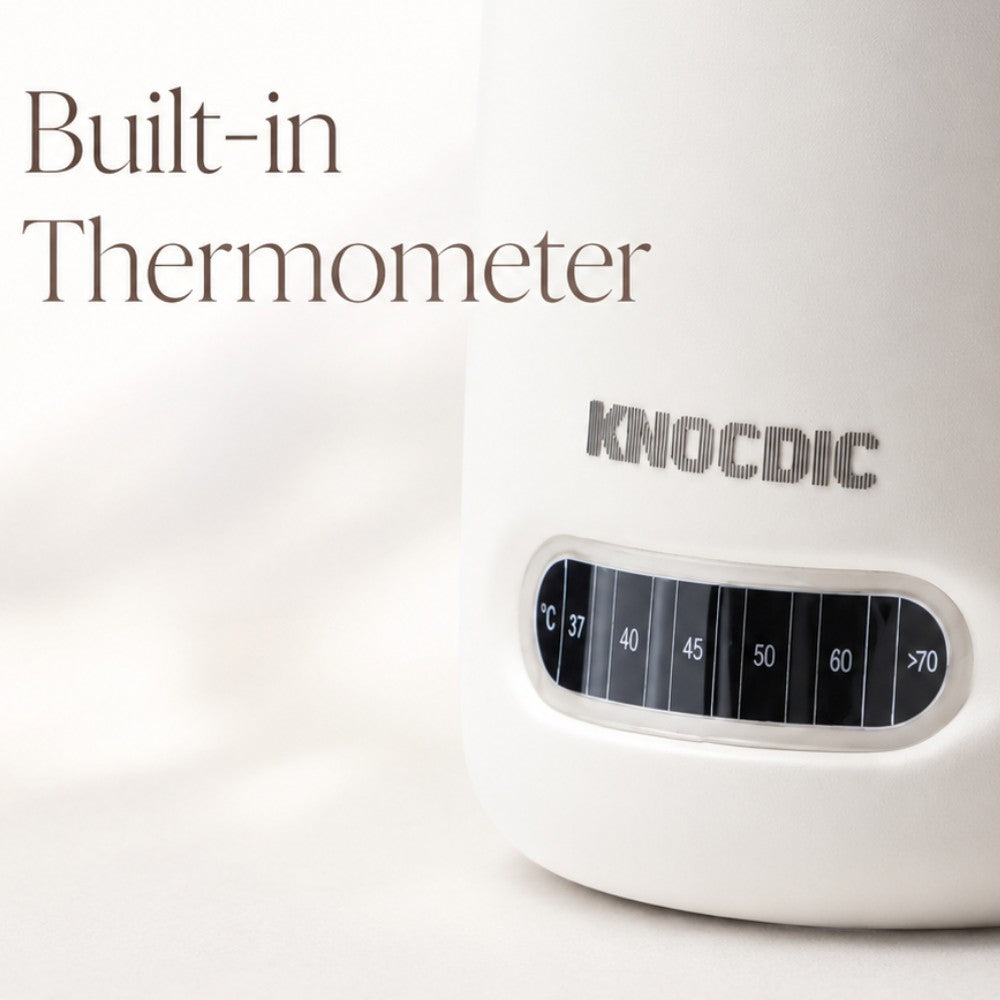 KNOCDIC® milk frothing pitcher with built-in thermometer for precise temperature control and smooth milk frothing.