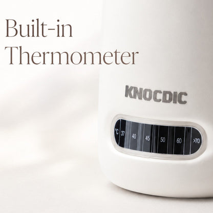 KNOCDIC® milk frothing pitcher with built-in thermometer for precise temperature control and smooth milk frothing.